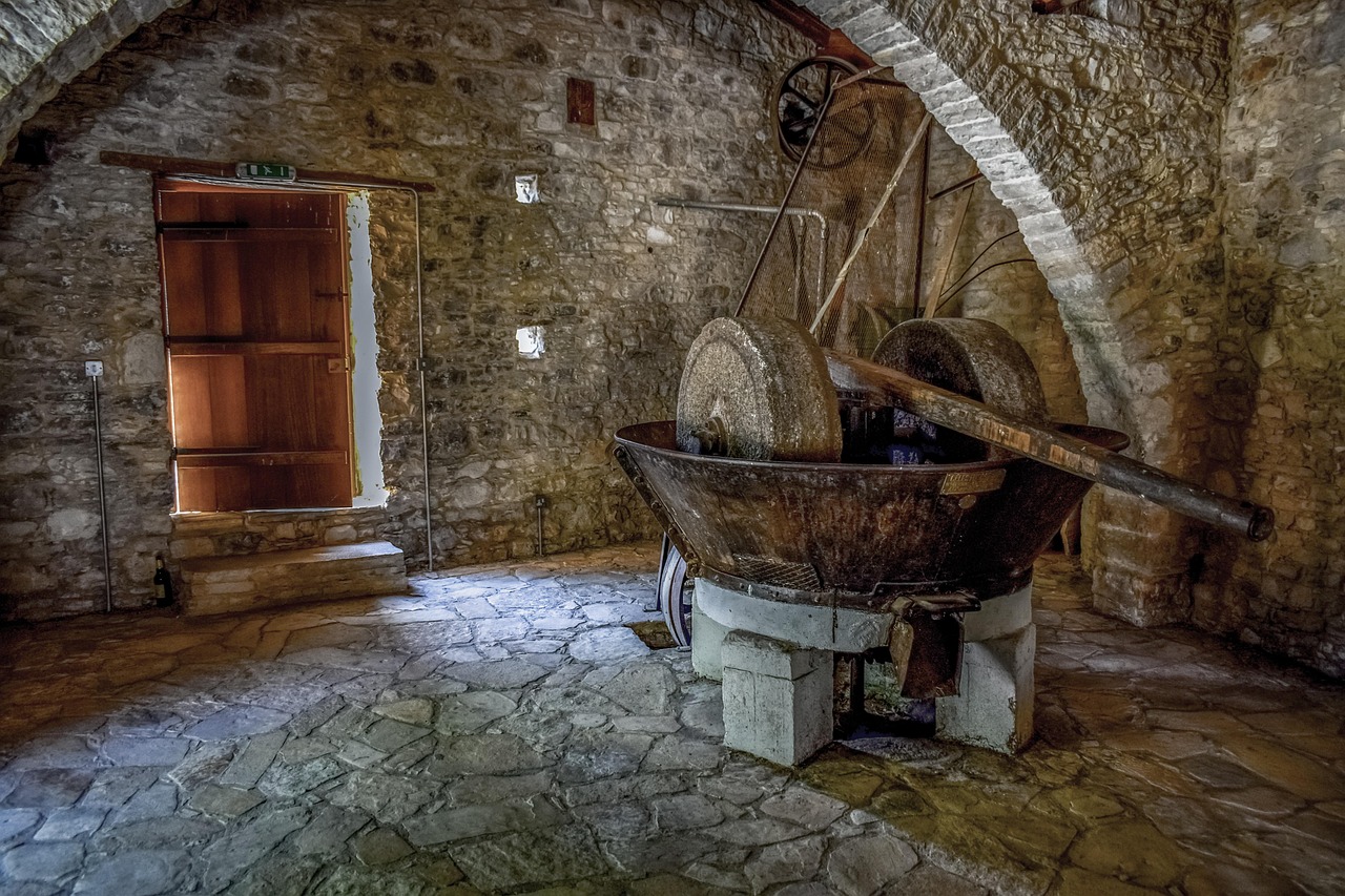 Traditional stone olive press in a Tuscan farmhouse